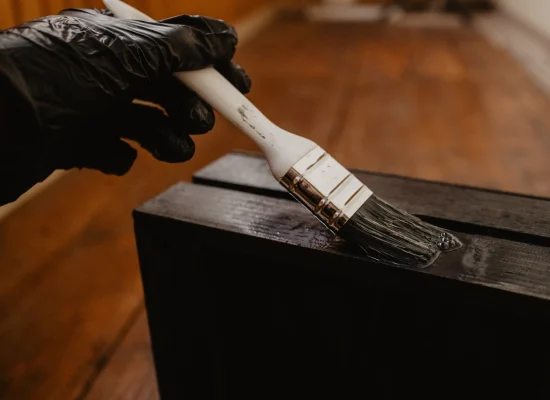 painting-wooden-crate-black-with-brush-and-glove-2026-03-17-21-25-41-utc